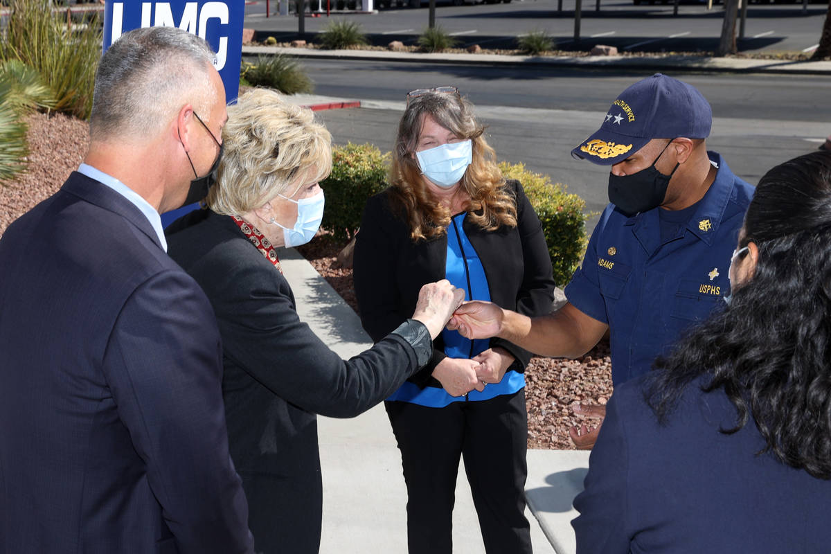 Mayor Carolyn Goodman, left, gifts a poker chip to Vice Admiral Jerome M. Adams, U.S. Surgeon G ...