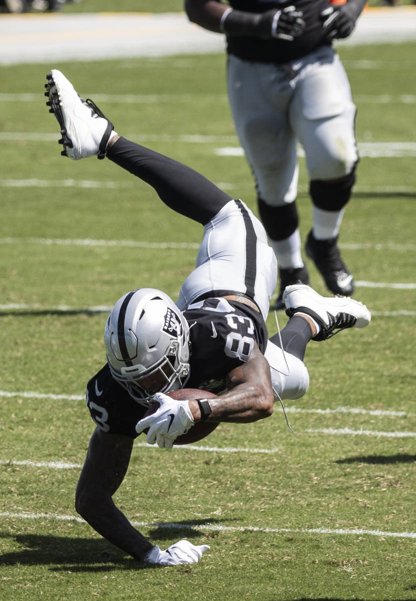Las Vegas Raiders tight end Darren Waller (83) dives for extra yardage in the second quarter of ...