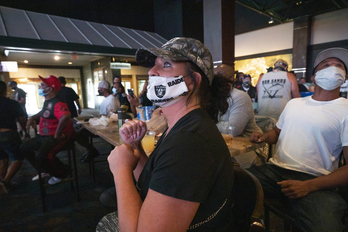 Raiders fan Kim Brooks, of Henderson, watches as the Raiders make a touchdown, viewed at the We ...