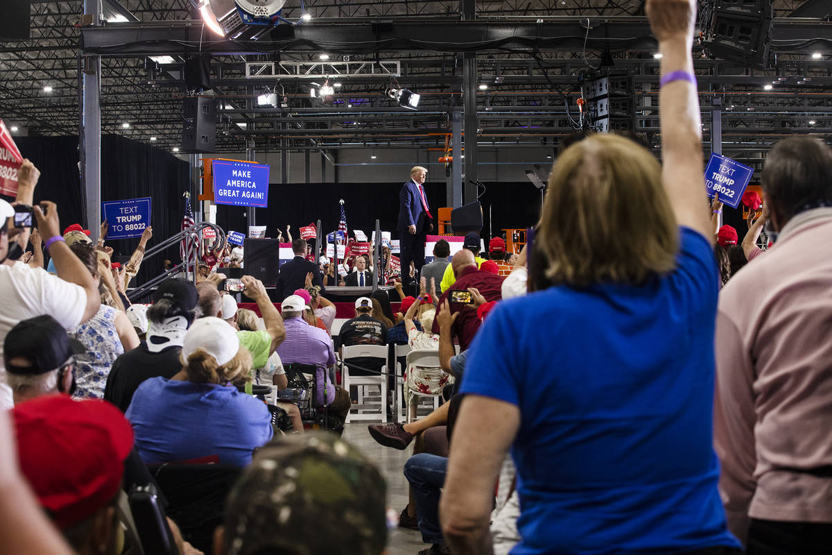 President Donald Trump addresses a large crowd at a campaign rally at Xtreme Manufacturing in H ...