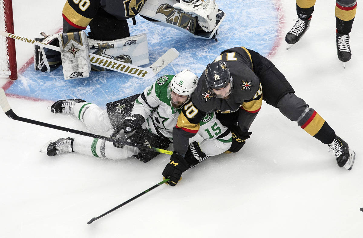 Dallas Stars' Blake Comeau (15) and Vegas Golden Knights' Nicolas Roy (10) battle in front of t ...