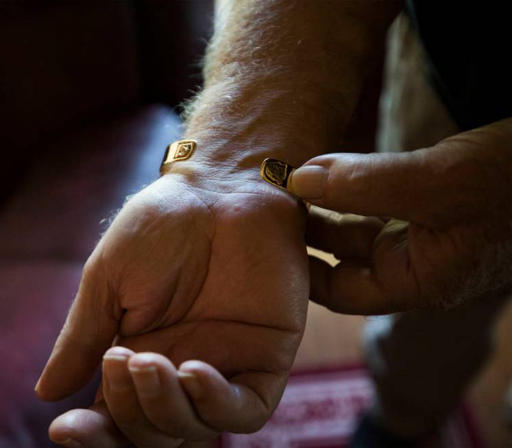 James “Bo” Gritz, a former U.S. Army Special Forces officer, shows his POW/MIA bracelet at ...