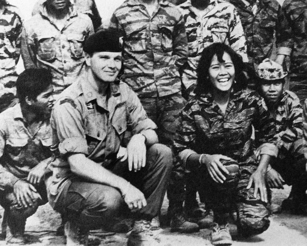 Special Forces leader James "Bo" Gritz and his friend in combat, Nurse Toi, pose with ...
