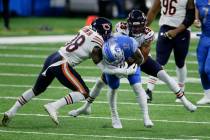 Chicago Bears free safety Tashaun Gipson (38) and cornerback Kyle Fuller (23) tackle Detroit Li ...