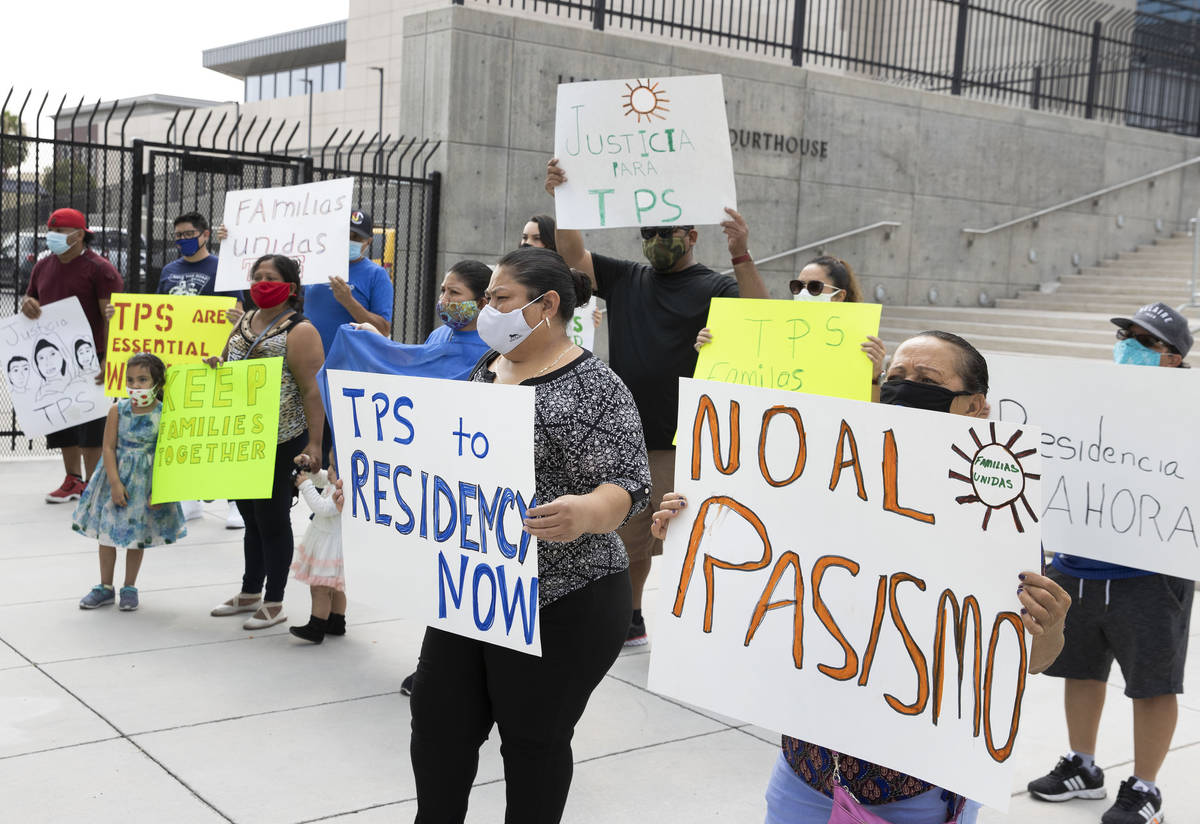 Temporary Protective Status (TPS) holders and community partners protest outside of Lloyd Georg ...
