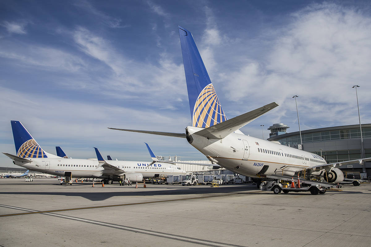 Aircraft line the tarmac at the United Airlines terminal at McCarran International Airport on T ...