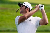 Jon Rahm, of Spain, watches his shot from the 11th fairway during a practice round before the U ...