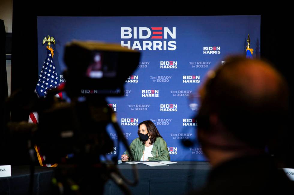 Democratic vice presidential candidate Sen. Kamala Harris, D-Calif., listens during a roundtabl ...