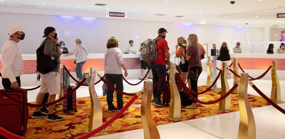 Gusts lined up to check in after the Tropicana hotel-casino reopens to public, on Thursday, Sep ...