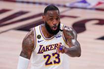 Los Angeles Lakers' LeBron James (23) signals during the second half of an NBA conference semif ...