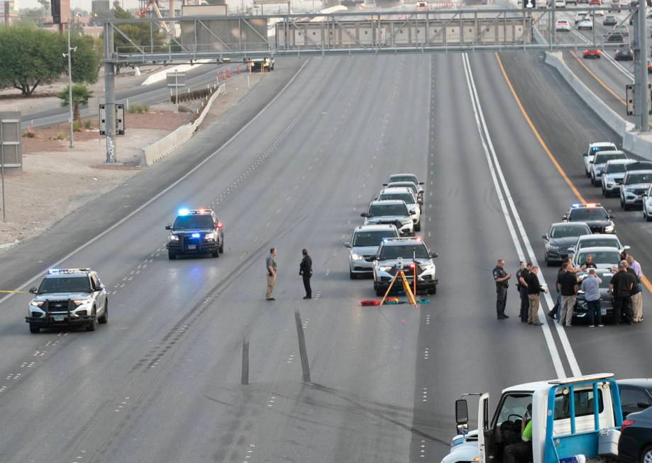 A team of officers and detectives investigate on Southbound I-15 near Flamingo exit on Wednesda ...