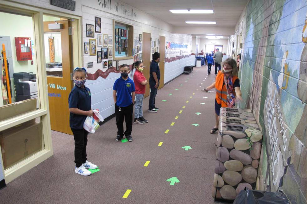 FILE - In this Aug. 18, 2020, file photo, students return to Greenbrae Elementary School in Spa ...