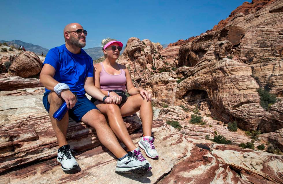 Brian DiCrescenzo, left, and Brittany Breisch of Chicago relax atop a ledge at the Calico 1 tra ...