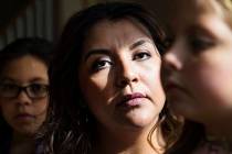 Adriana May-Azuero, center, and her children Sophia May, 11, left, and Jaise May, 7, right, at ...