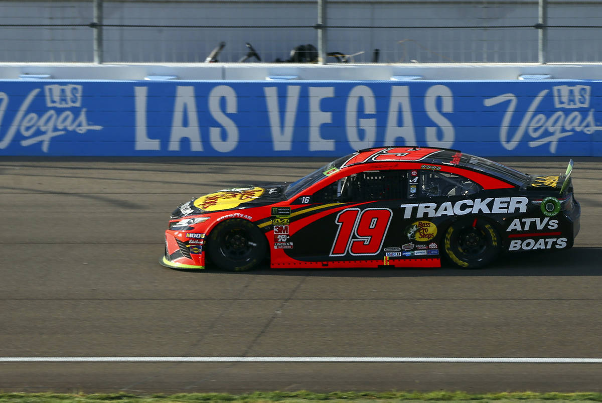 Martin Truex Jr. (19) drives during a NASCAR Cup Series auto race at Las Vegas Motor Speedway, ...