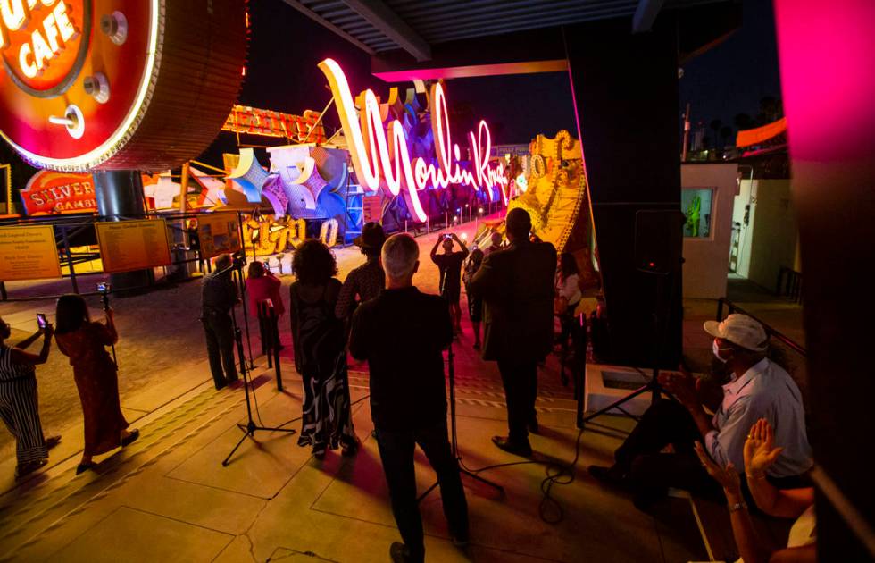 Rob McCoy, president and CEO of the Neon Museum,ʣenter, watches alongside Dee Dee Jasmine ...