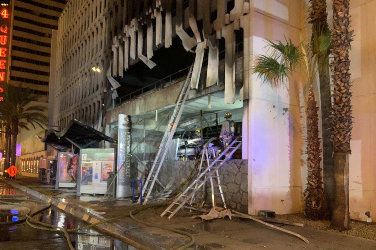At least five vehicles caught fire on the first level of the 4 Queens Hotel & Casino parking ga ...