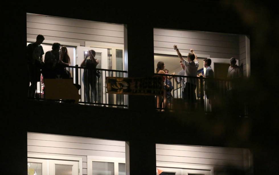 FILE - In this Sept. 1, 2020 file photo, partiers congregate on the balcony of a downtown apart ...