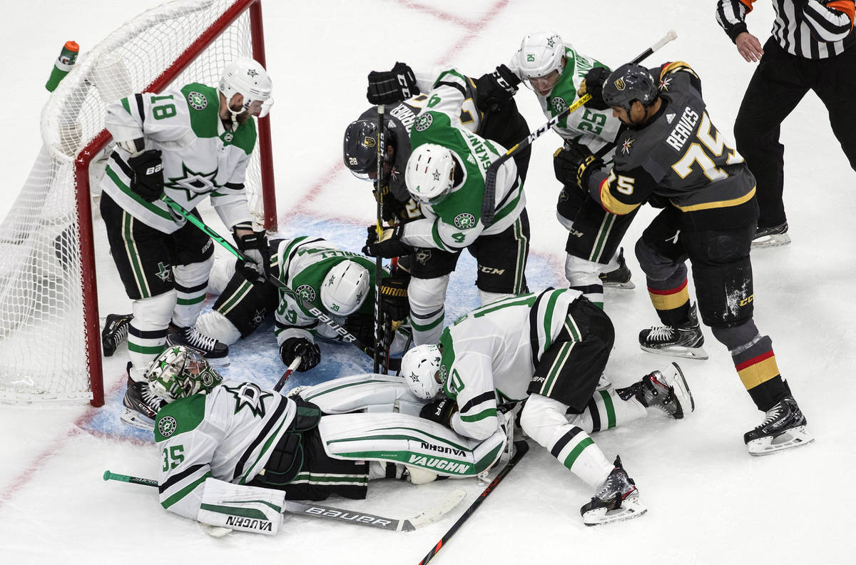 Dallas Stars' goalie Anton Khudobin (35) makes a save and covers the puck against the Vegas Gol ...