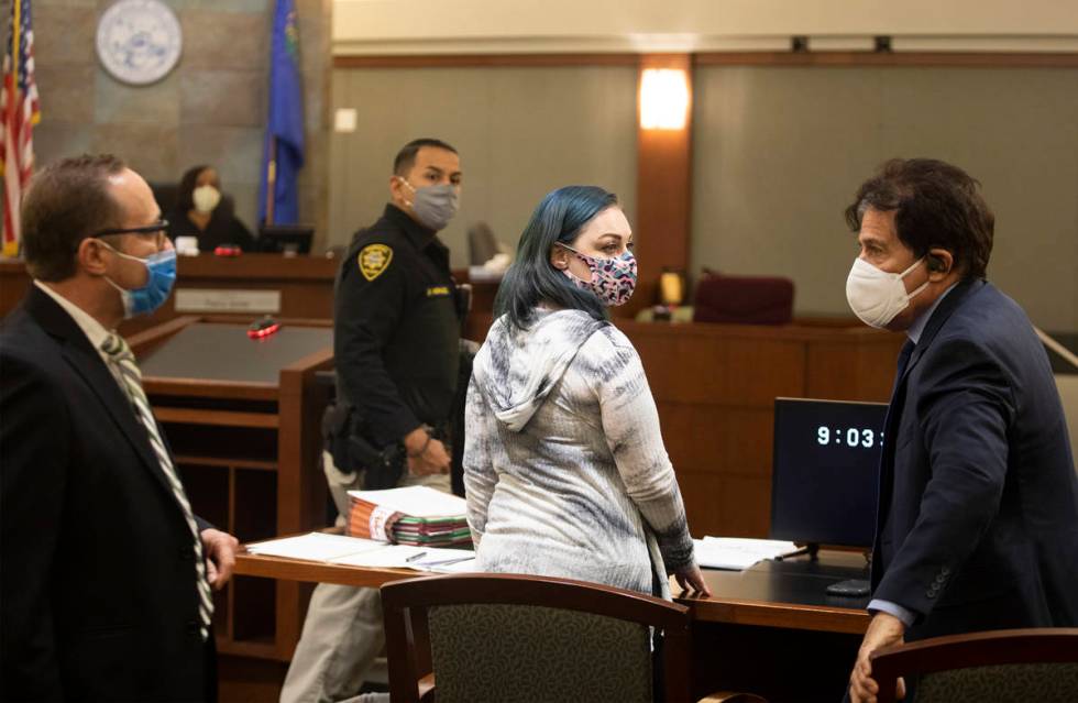 Alisha Burns makes her way to the stand next to her lawyer Tony Abbatangelo, left, and law cler ...