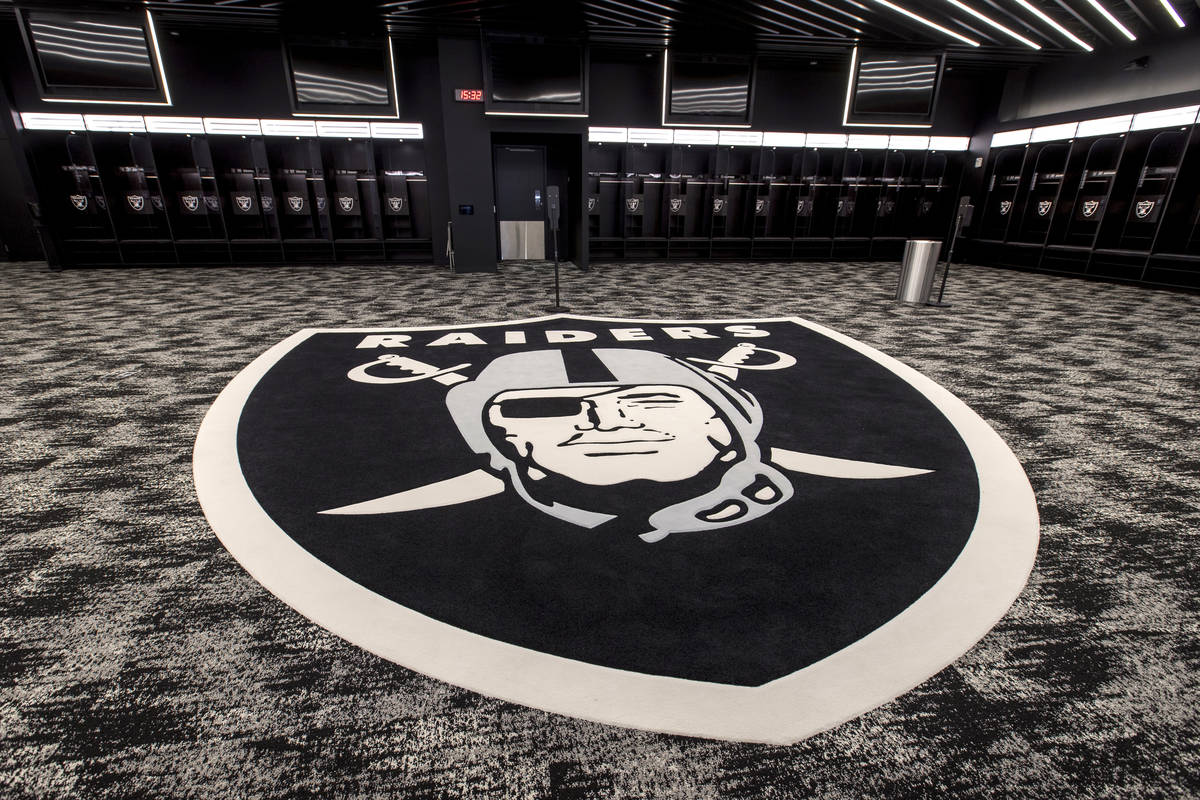 The locker room for the Las Vegas Raiders features a large logo and plenty of room to move for ...