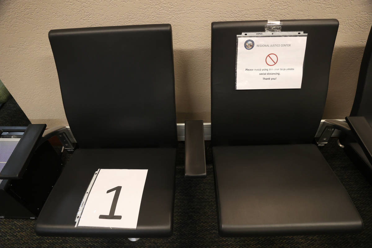 A social distancing seating arrangement at the Regional Justice Center jury services room in La ...
