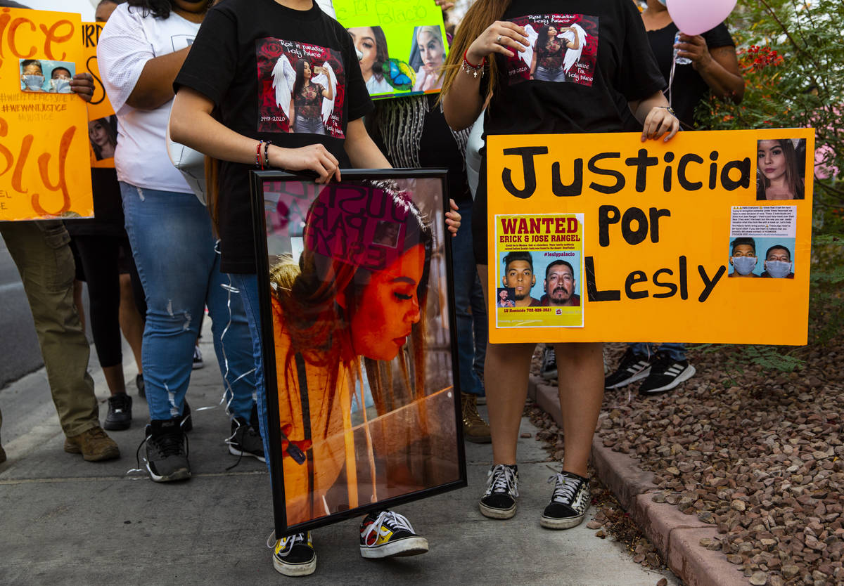 Family members hold pictures of Lesly Palacio, who was found slain near Valley of Fire State Pa ...