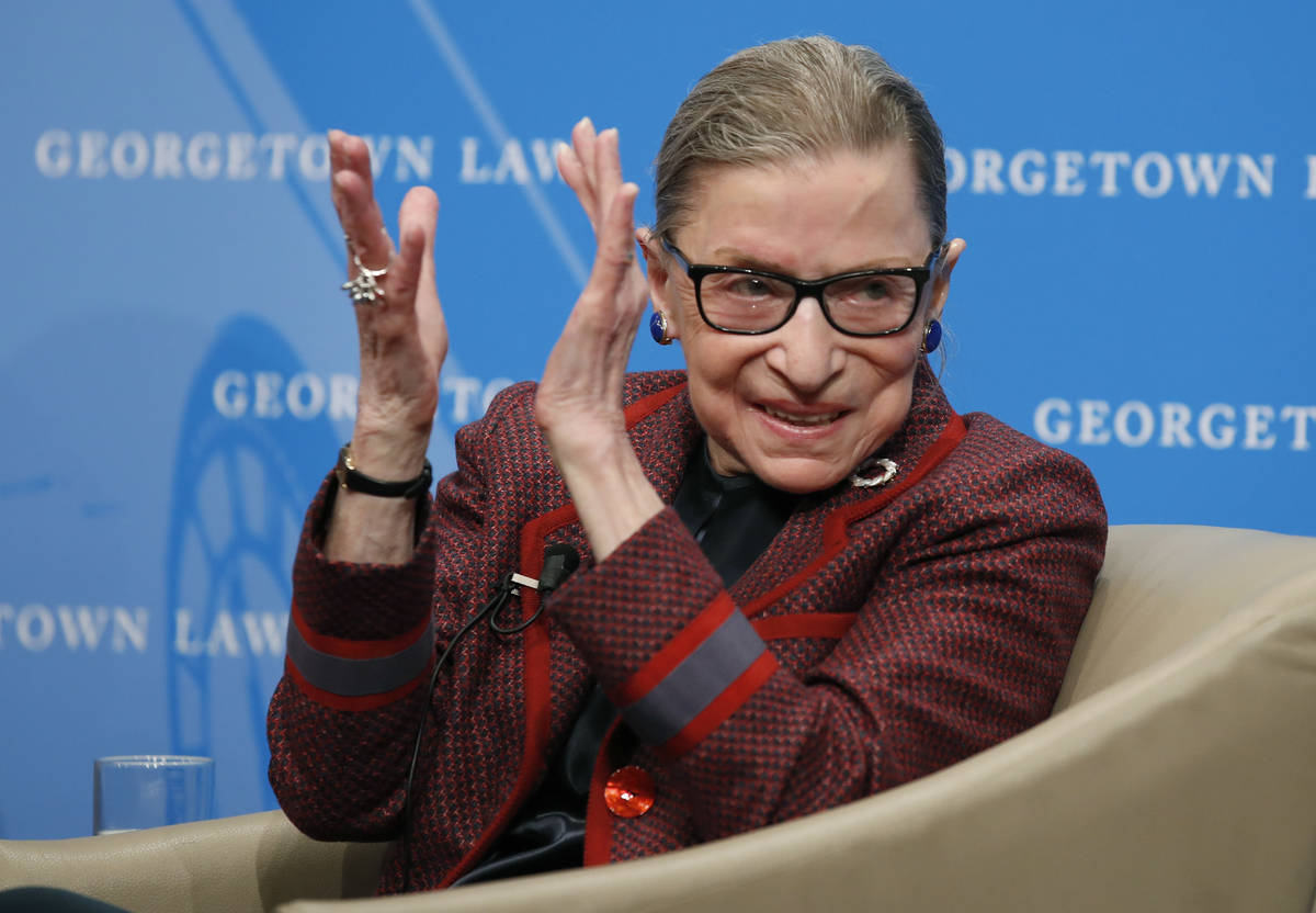 In this April 6, 2018, file photo, Supreme Court Justice Ruth Bader Ginsburg applauds after a p ...