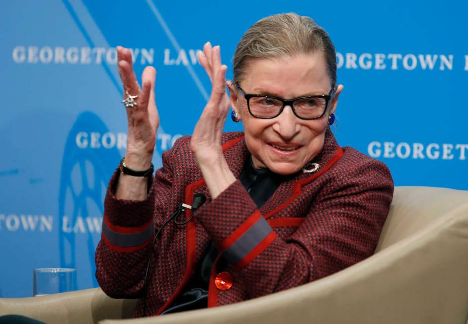 In this April 6, 2018, file photo, Supreme Court Justice Ruth Bader Ginsburg applauds after a p ...