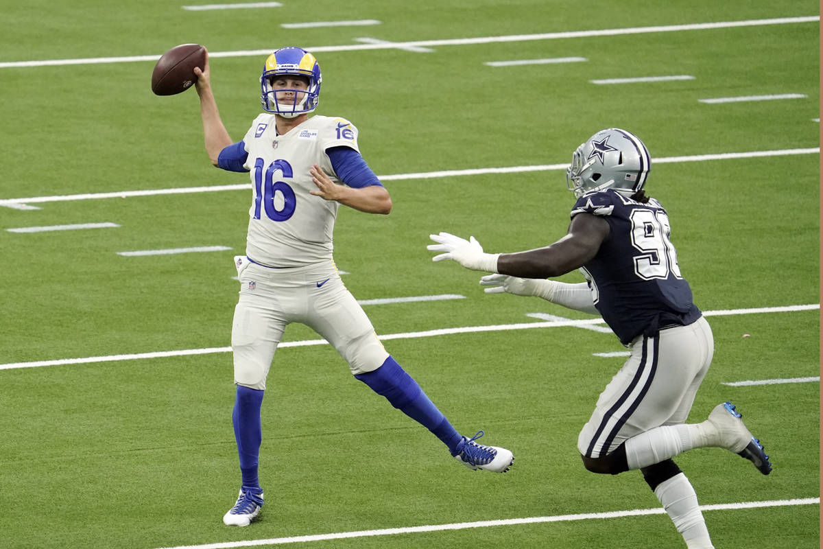 Los Angeles Rams quarterback Jared Goff throws against the Dallas Cowboys during the first half ...