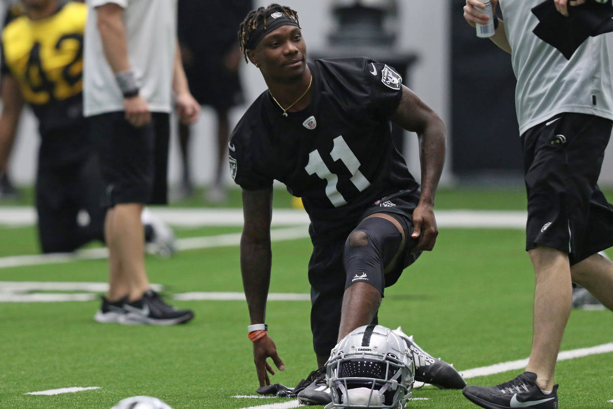 Las Vegas Raiders wide receiver Henry Ruggs III (11) stretches during a practice session at tea ...