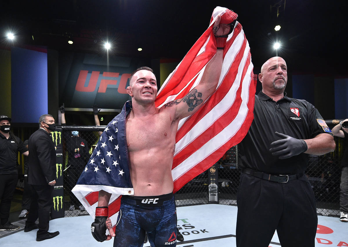 Colby Covington reacts after his TKO victory over Tyron Woodley in their welterweight bout duri ...