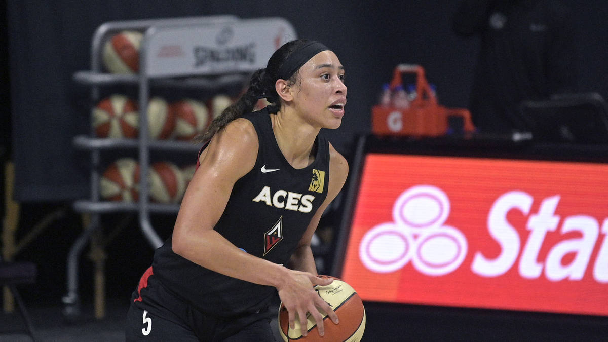 Las Vegas Aces forward Dearica Hamby (5) looks to pass the ball up the court during the first h ...