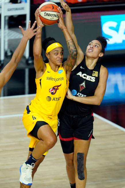 Indiana Fever forward Candice Dupree (4) goes up against Las Vegas Aces forward Dearica Hamby ( ...
