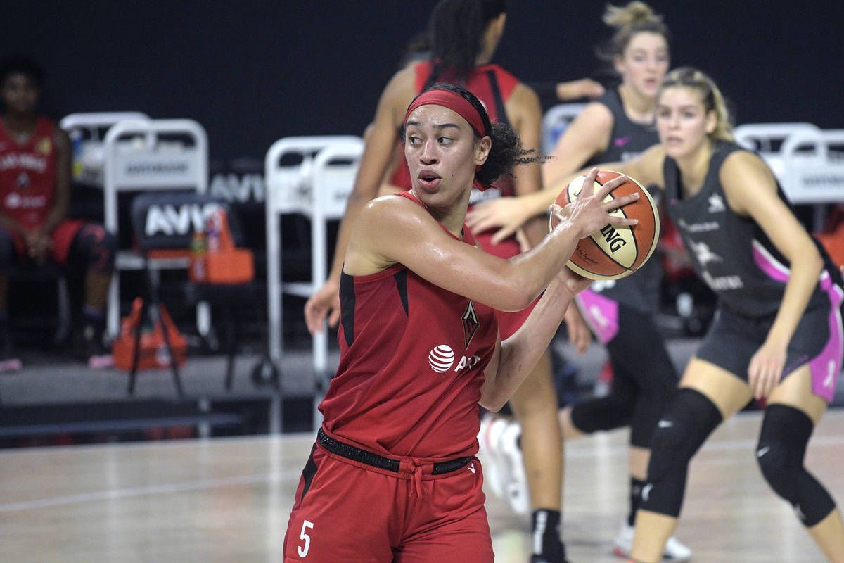 Las Vegas Aces forward Dearica Hamby (5) controls the ball during the first half of a WNBA bask ...