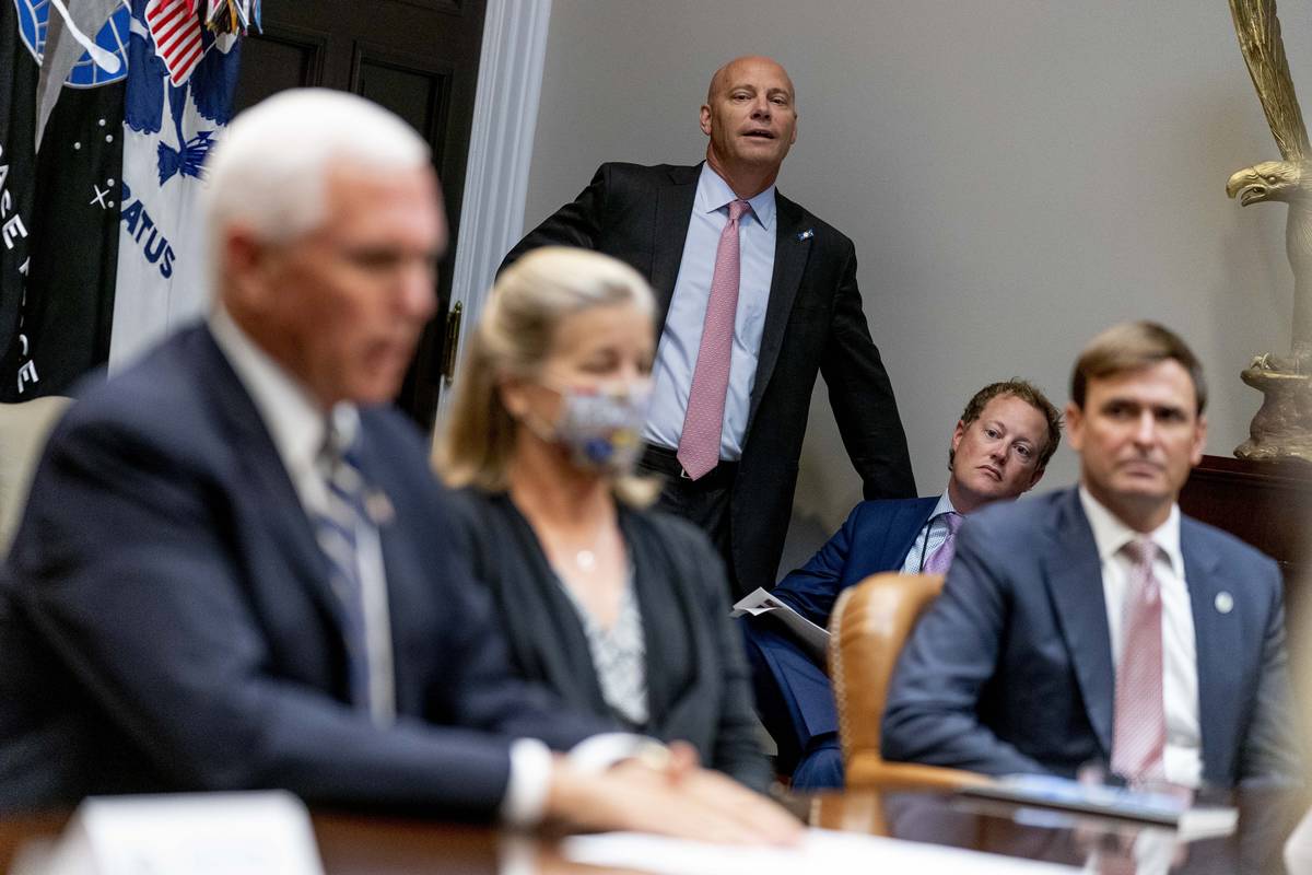 Vice President Mike Pence's Chief of Staff Marc Short, center, listens as Vice President Mike P ...