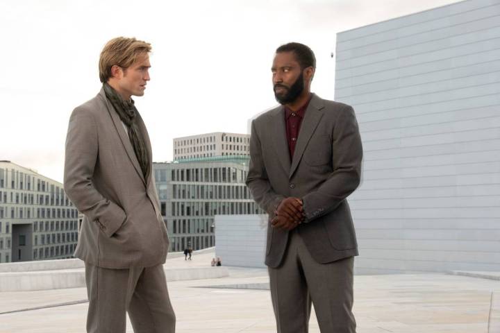 Robert Pattinson, left, and John David Washington star in a scene from "Tenet." (Melinda Sue Go ...