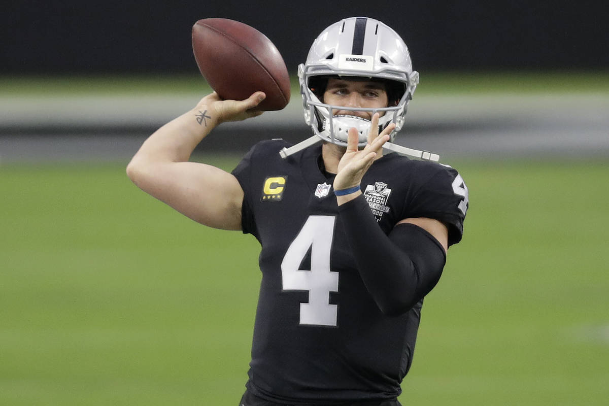 Las Vegas Raiders quarterback Derek Carr (4) warms up prior to an NFL football game against the ...