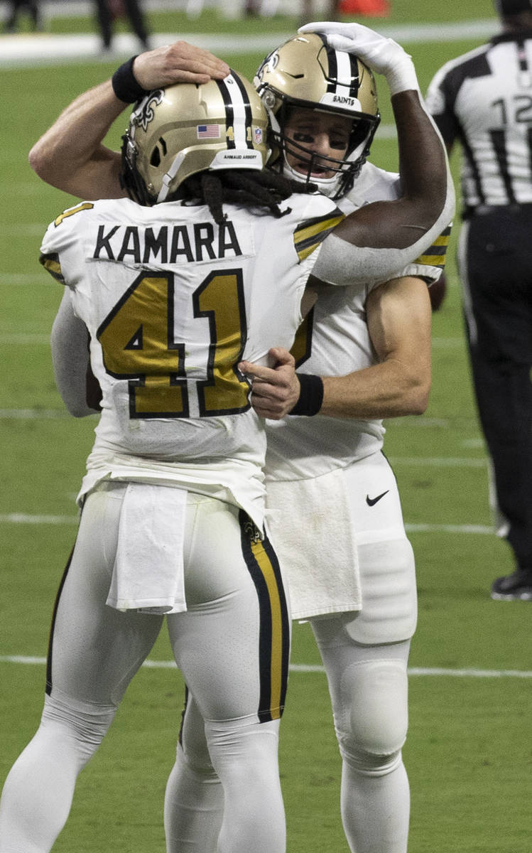 New Orleans Saints running back Alvin Kamara (41) celebrates with New Orleans Saints quarterbac ...