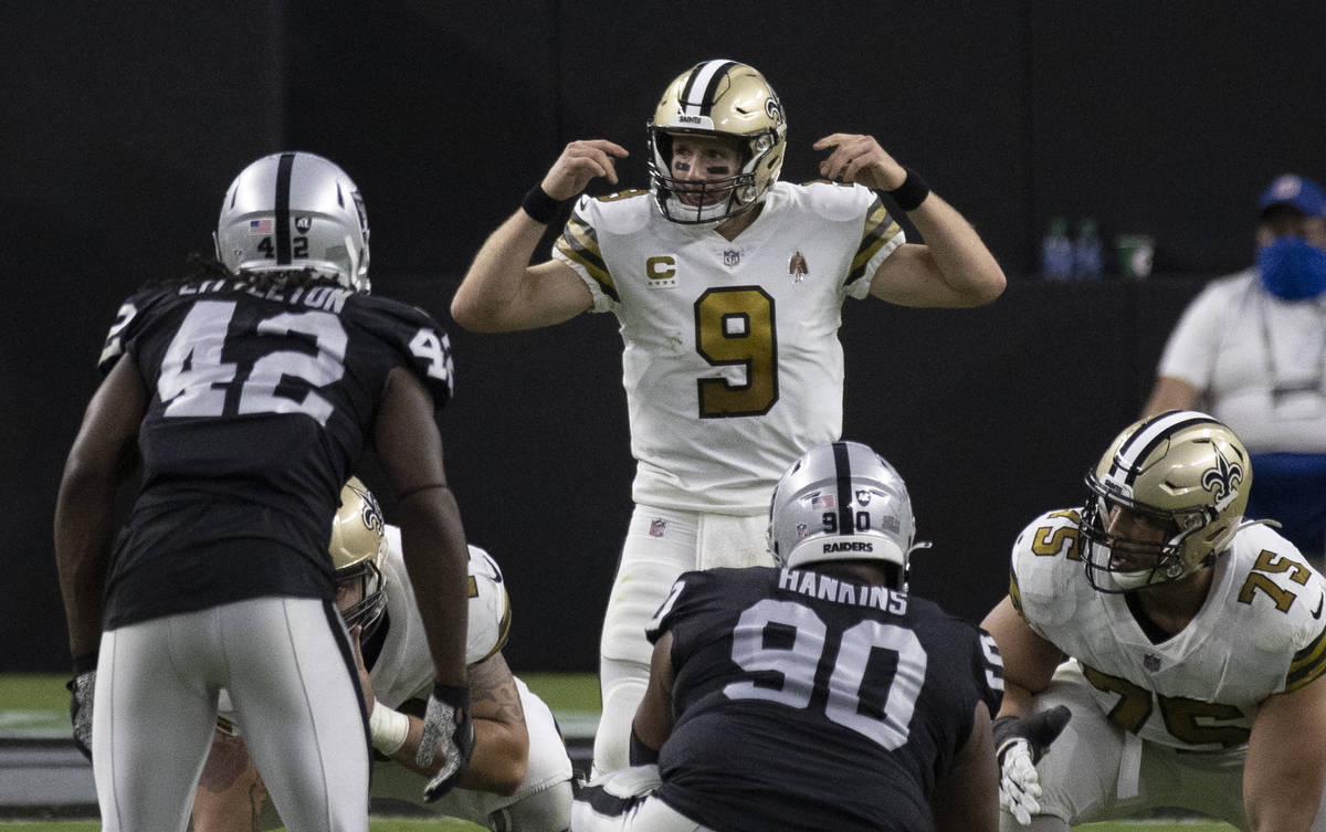New Orleans Saints quarterback Drew Brees (9) directs traffic in the first quarter during an NF ...