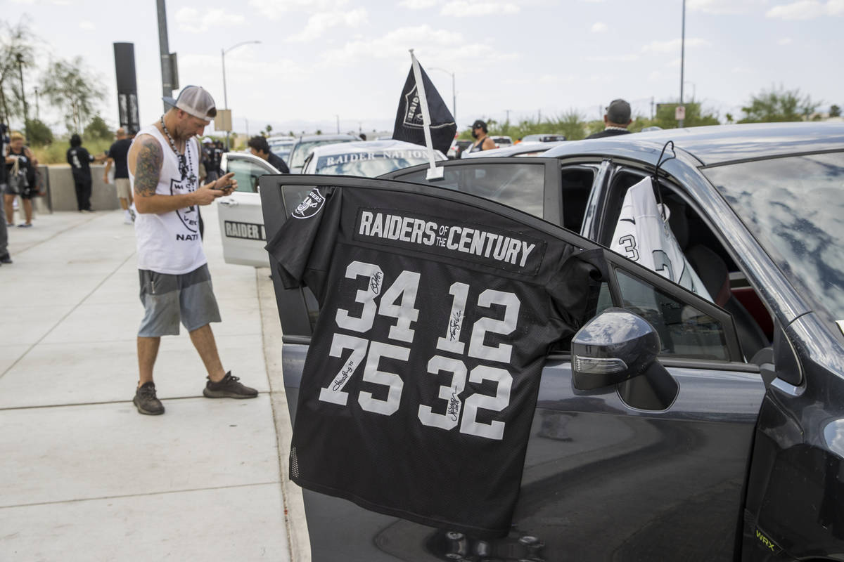 Las Vegas Raiders jerseys are for sale as fans gather outside several hours before the kickoff ...