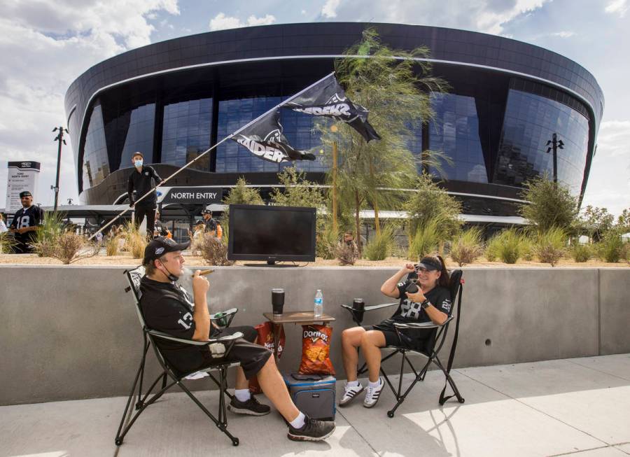 Las Vegas Raiders fans Kenna James, left, and Julie Goldman have their spot set up outside seve ...
