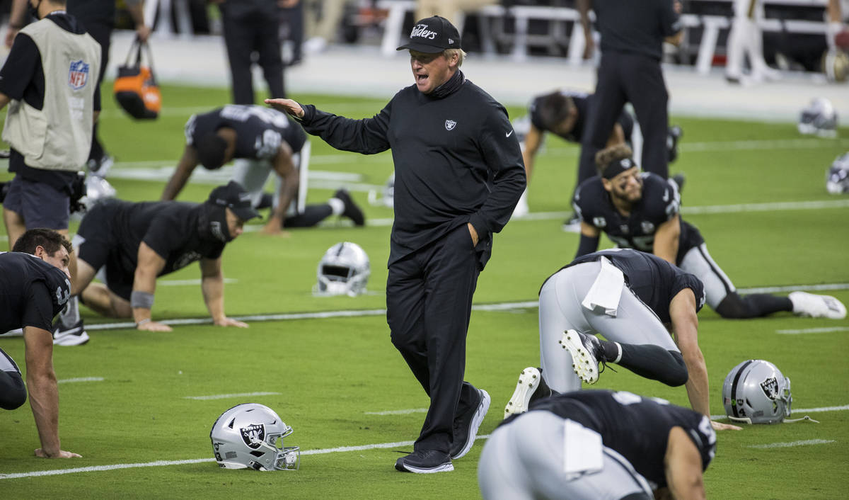 Las Vegas Raiders head coach Jon Gruden talks up his players during warm ups before the Raiders ...