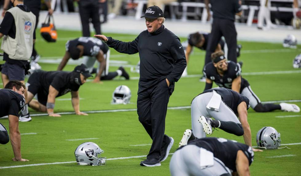 Las Vegas Raiders head coach Jon Gruden talks up his players during warm ups before the Raiders ...