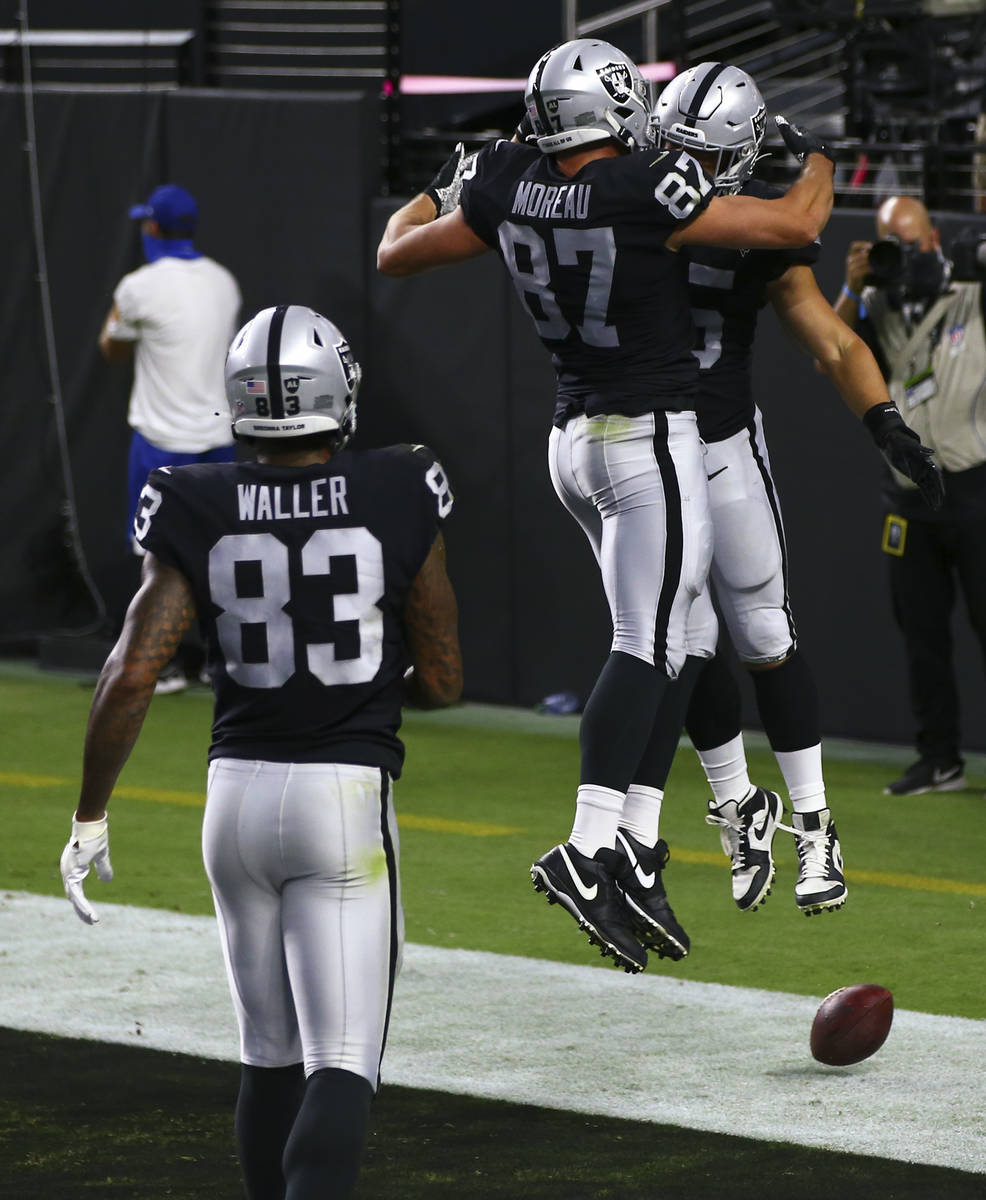 Las Vegas Raiders fullback Alec Ingold, right, celebrates with tight end Foster Moreau (87) aft ...