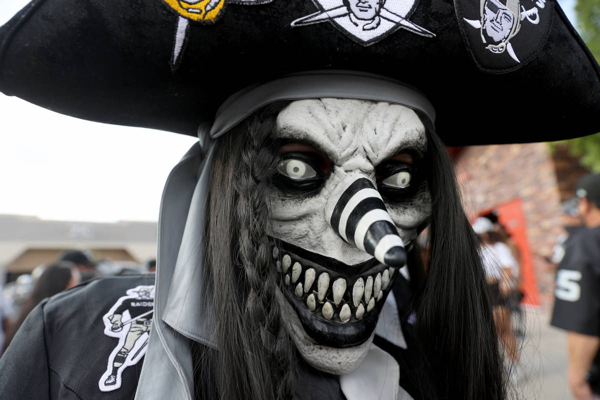Survarious Twoknives of Bakersfield, Calif. poses during a Las Vegas Raiders watch party at Tom ...