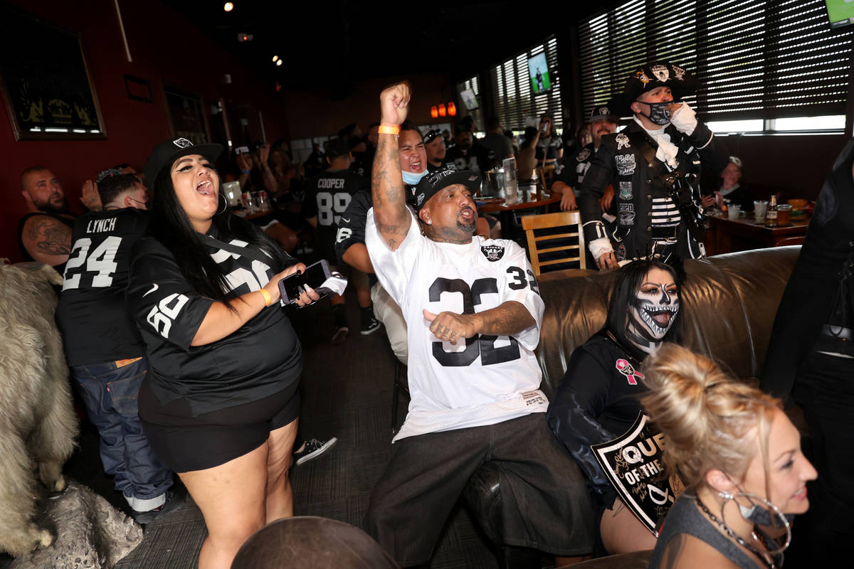 Fans cheer the opening kickoff during a Las Vegas Raiders watch party at Tommy Rocker's in Las ...