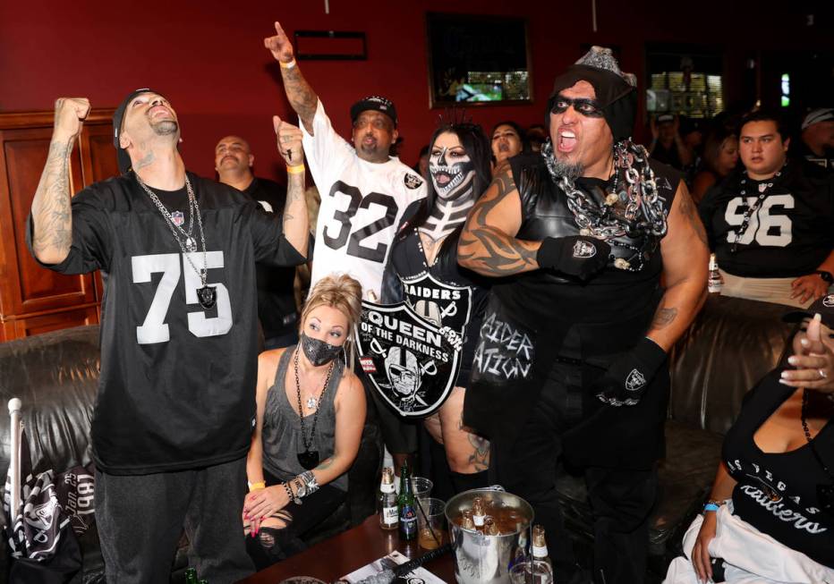 Fans, from left, James Weatherbie, his wife Savana, of Rowland Heights, Calif., Paul Lopez, his ...