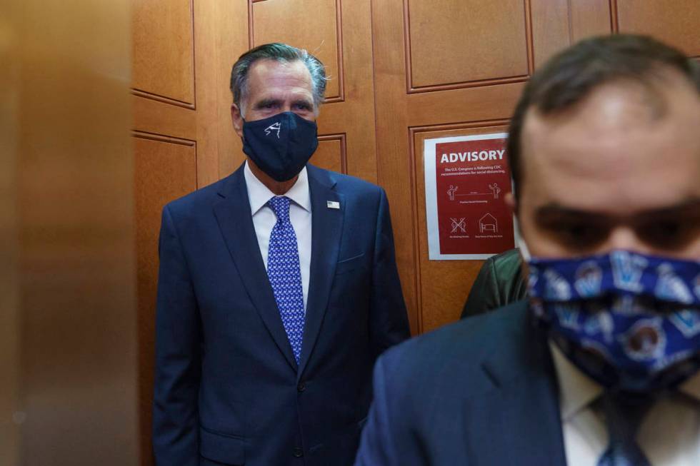 Sen. Mitt Romney, R-Utah, leaves the Senate Chamber after a procedural vote, at the Capitol in ...