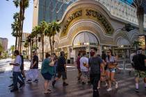 People walk outside of the Golden Nugget at the Fremont Street Experience in downtown Las Vegas ...
